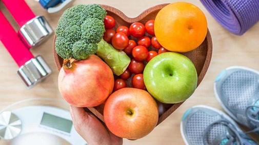 a heart-shaped bowl of fruit