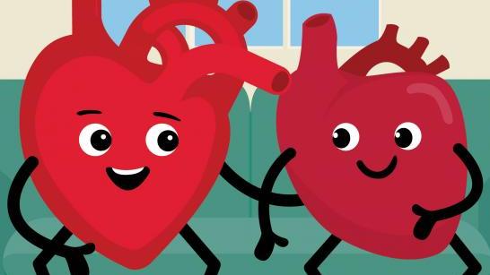 Heart characters sitting on sofa smiling