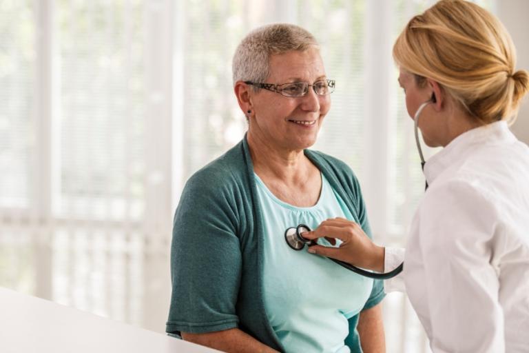 Doctor listening to a patient's heart with a stethoscope