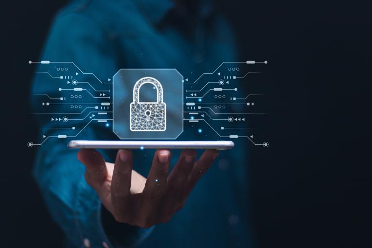 Businessman show virtual padlock icon for protecting personal data and secure internet access