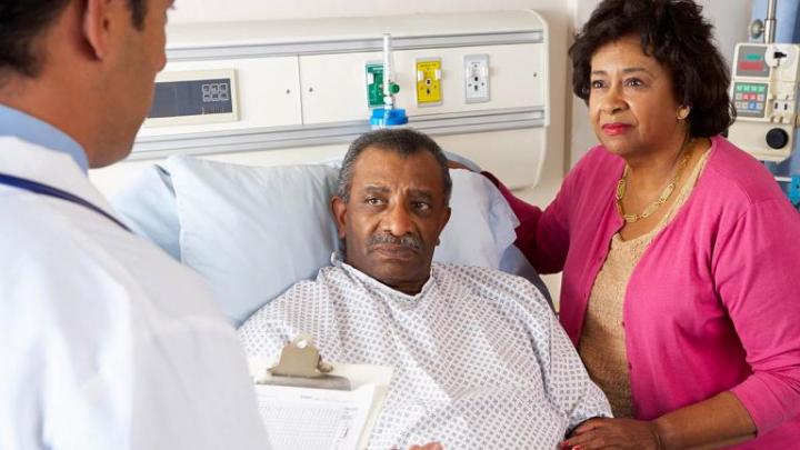 African American couple and hospital bed